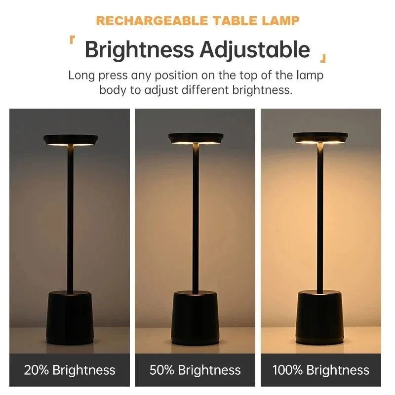 Cordless touch LED table lamp glowing warmly on a bedside table