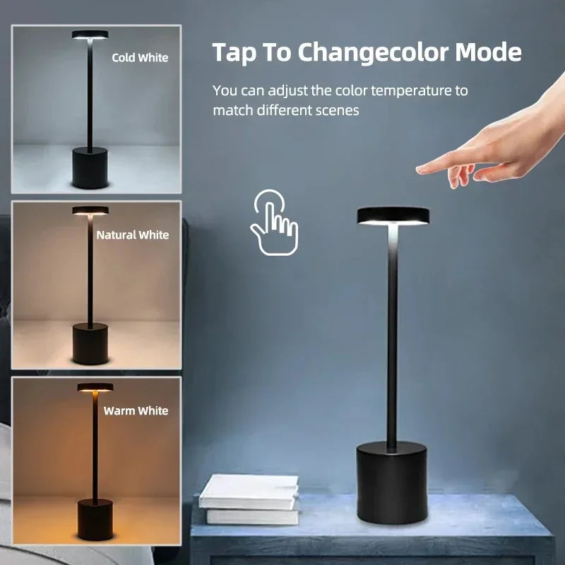 Cordless touch LED table lamp glowing warmly on a bedside table