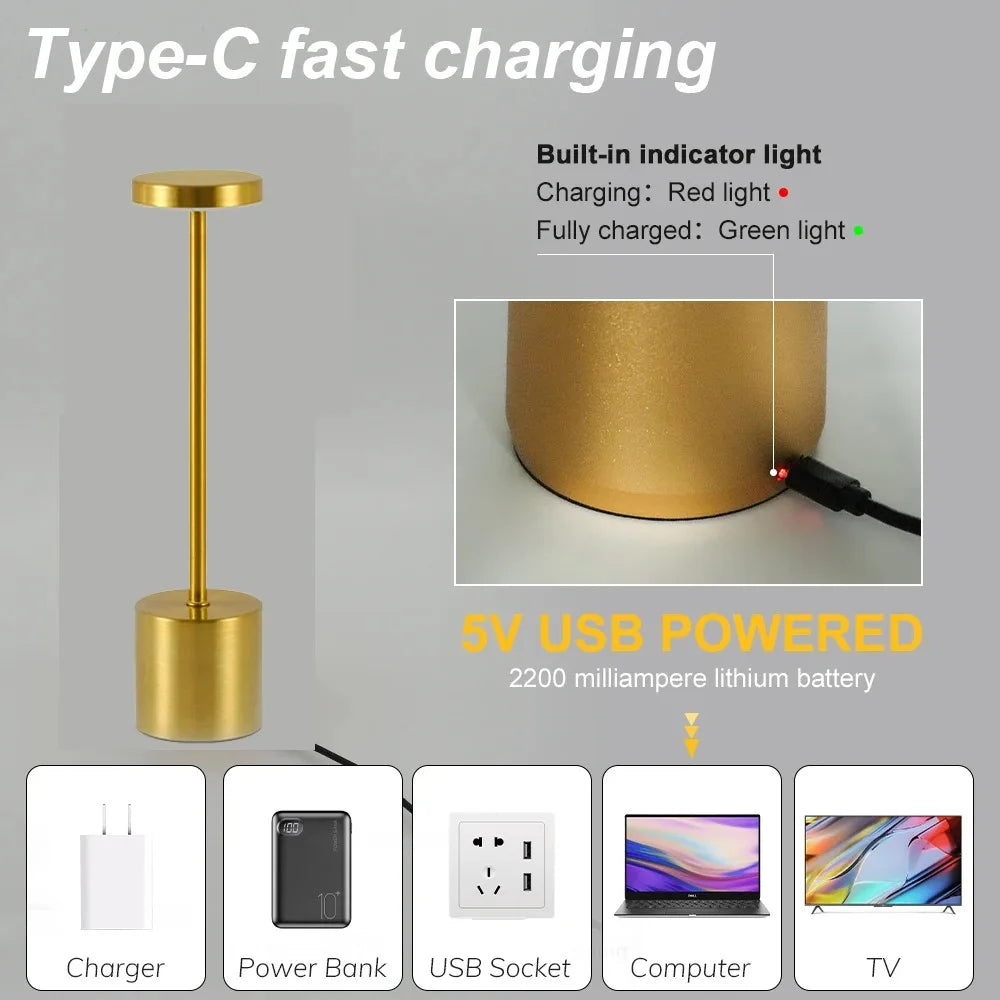 Cordless touch LED table lamp glowing warmly on a bedside table