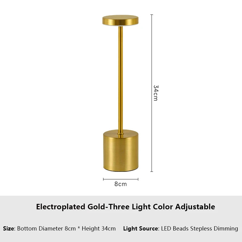 Cordless touch LED table lamp glowing warmly on a bedside table